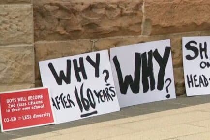 Protests signs outside of newington college